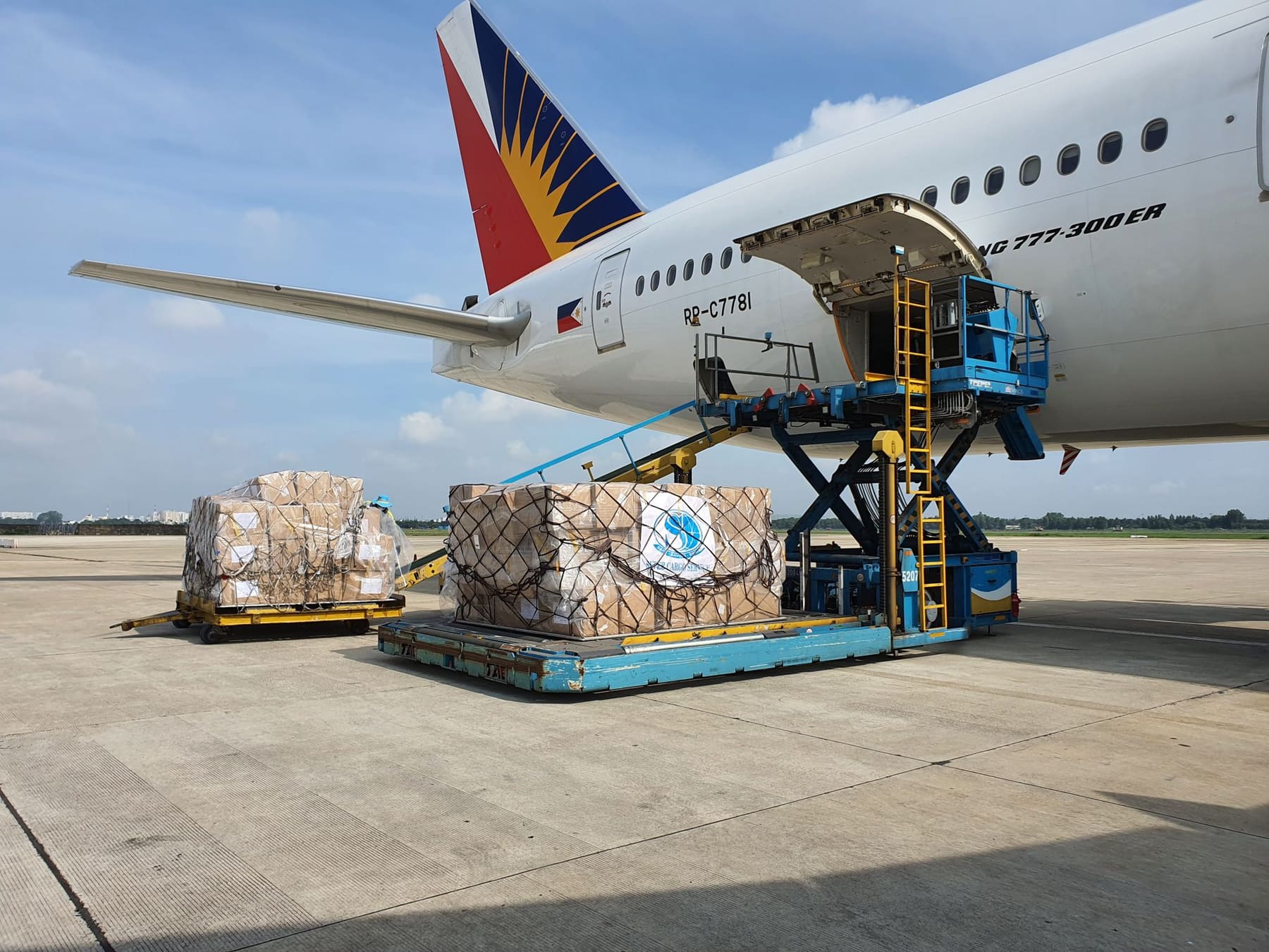 Palletised cargo being loaded onto a passenger airliner